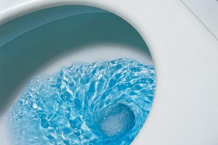 blue-water-toilet-flushing-590bes080610.jpg